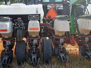 Row units of white planter.