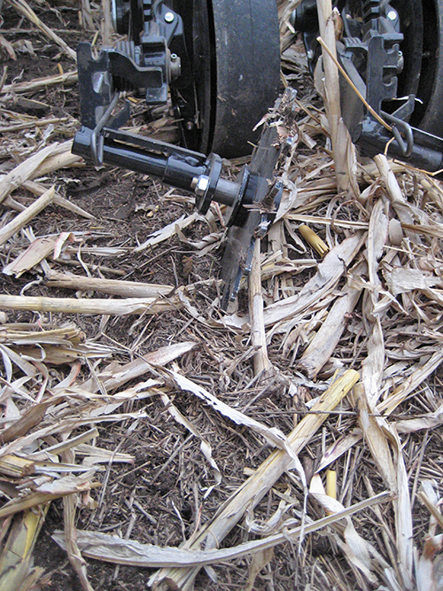 Up close look at toe-out bracket kit for Thompson Wheel on a Case IH P-500 drill.