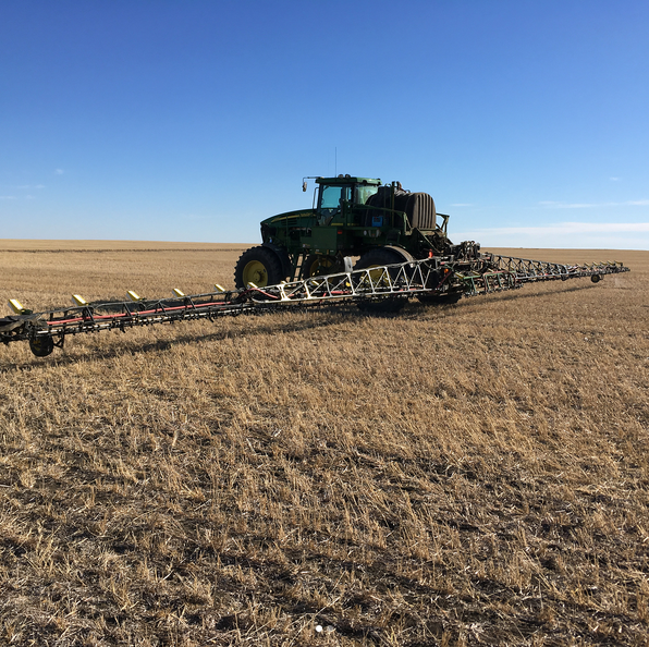 Weedit on a John Deere sprayer in a field.