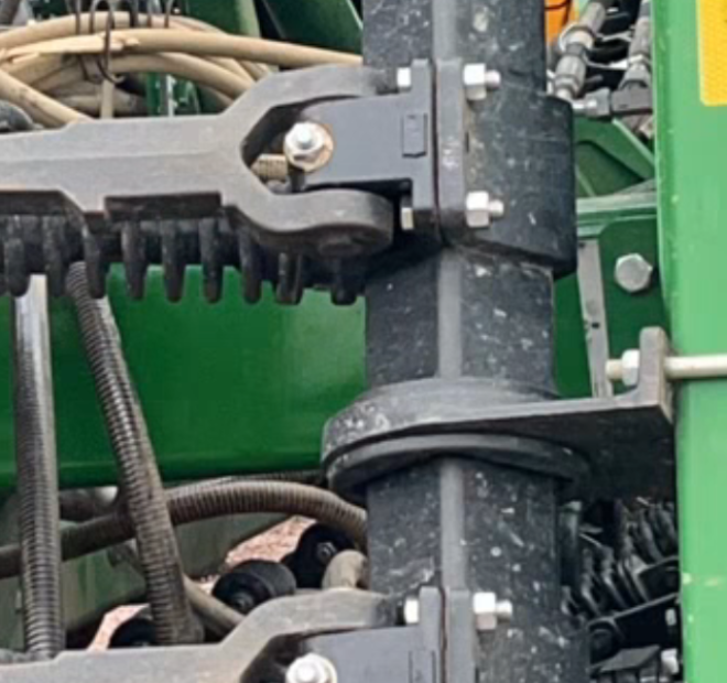 Close look at the retaining bolt main pin on a John Deere.